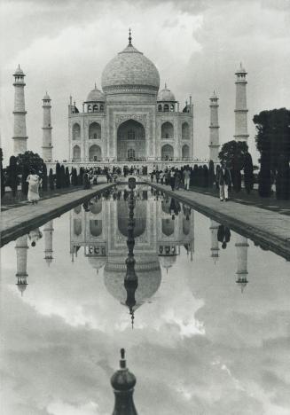 The Taj Mahal's reflecting pools show its magnificence, despite the protruding spikes
