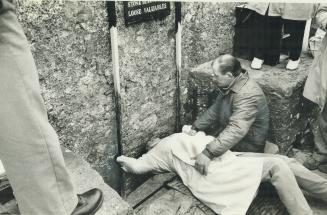 Visitors feel safer being held when they kiss the Blarney Stone eight storeys above the ground