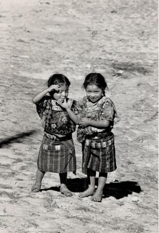 At left two shy young Maya villagers