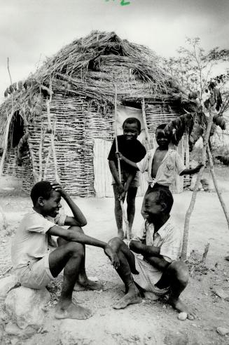 Despite the bitter struggle for survival, boys of the village find something to smile about
