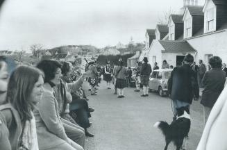 A Local Pipe Band collects a crowd of visitors and residents as it plays before a pub on the main street of the Skye village of Armadale. The island i(...)