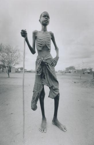 Lual Agoth, who thinks he's about 13, walked for six months to reach the refugee camp near Torit, telling his mother as he left I cannot die here . . . I'm going to look for food and an education