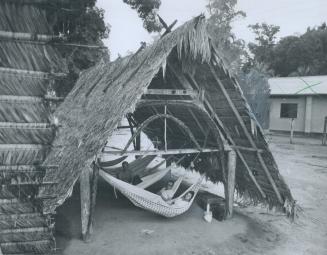 Guest accommodation at the village of Langetabbetja in the jungle is wide open to nature, two Star men found on safari