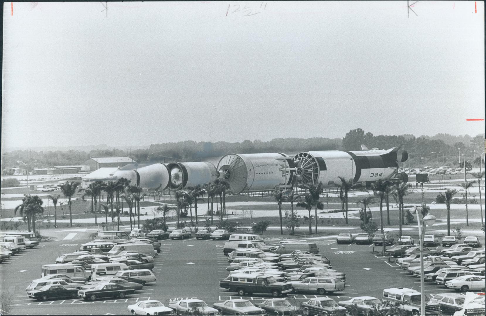 At Kennedy Space Centre the gigantic 180-million-horsepower, 363-foot Apollo/Saturn V rocket dwarfs not only the cars but the parking lot itself