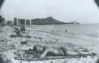And when you're tired of surface and/or spectating you can stretch out in the sun on Waikiki Beach and just relax