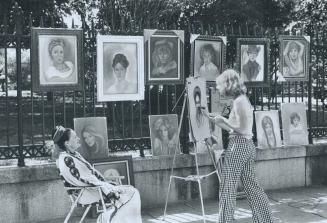 A sidewalk studio in New Orleans' Jackson Square becomes an informal location for a portrait artist and her client