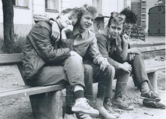Hanging out: Punk rockers, an uncommon site in Riga, loaf on a bench near a railroad station