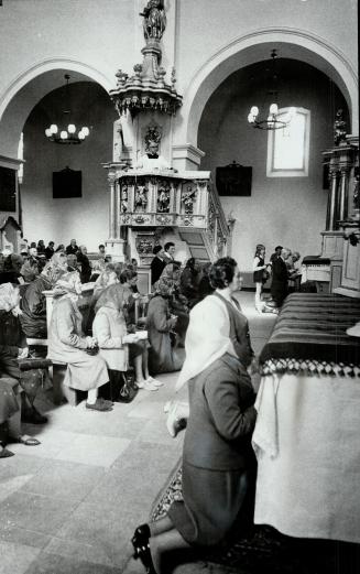 Worshippers Pray in a Roman Catholic Church near Warsaw