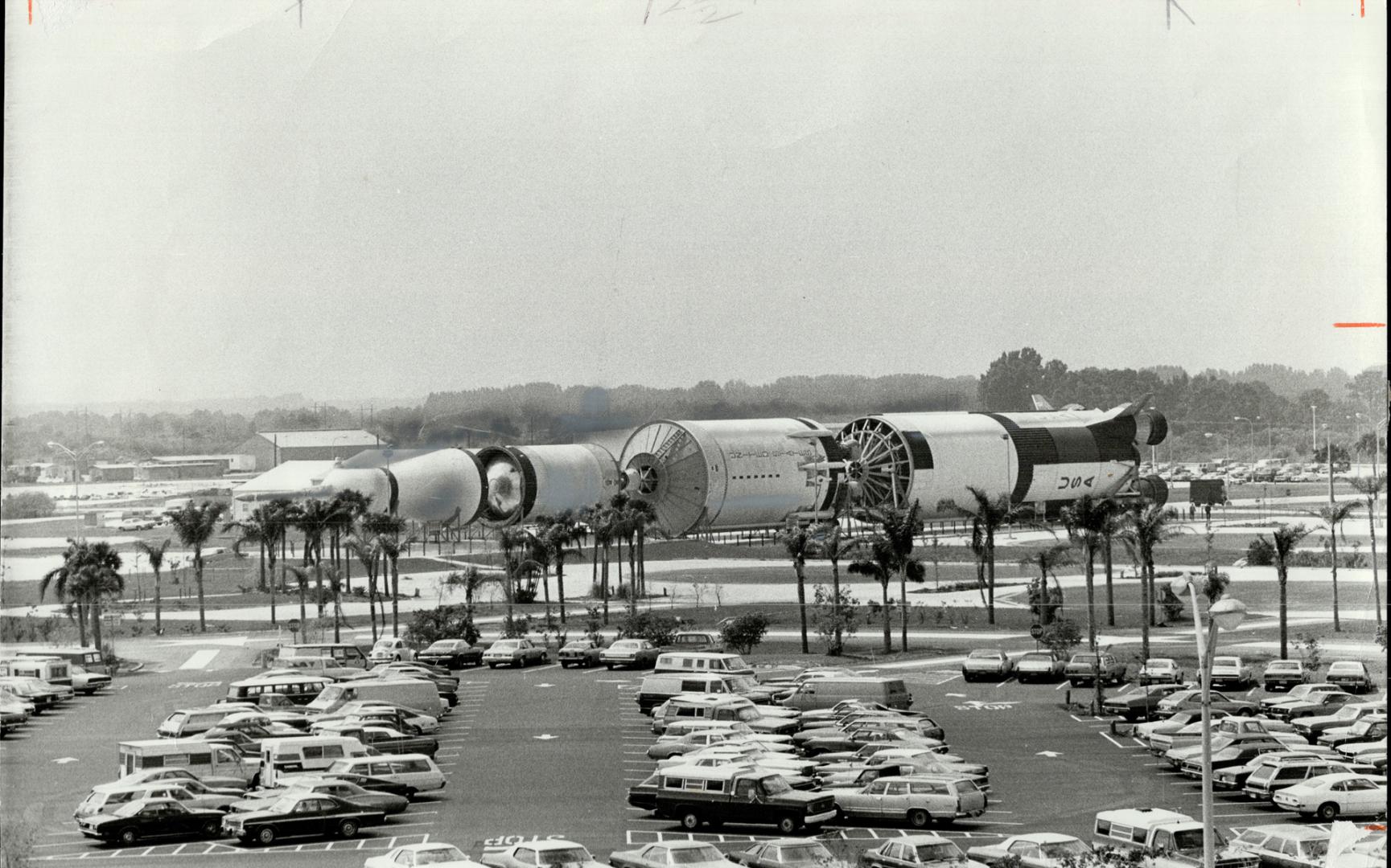 At Kennedy Space Centre the gigantic 180-million-horsepower, 363-foot Apollo/Saturn V rocket dwarfs not only the cars but the parking lot itself