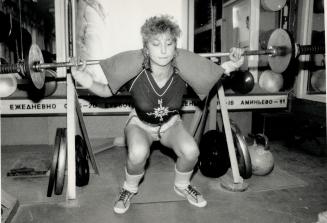 'Russian women have so many worries in life that we must be both strong and beautiful,' says Natasha Serova, here performing barbell squats