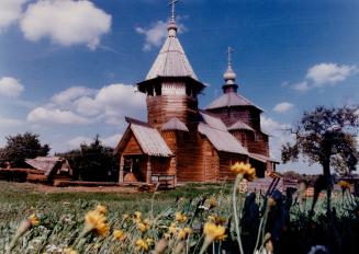 Above, the wooden Resurrection Church built in 1776 by the village of Potakino near Suzdal