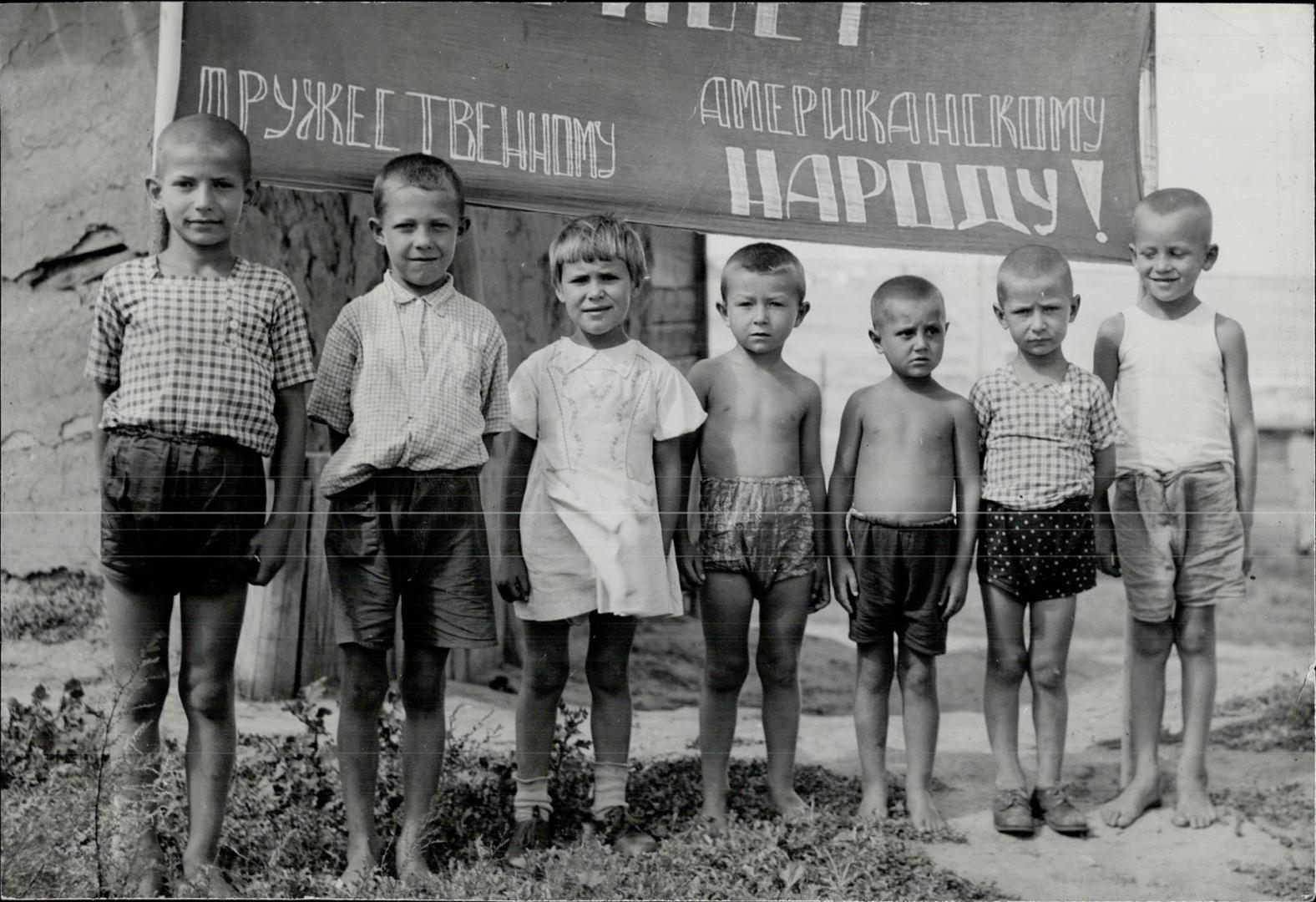 When the camera man visited this tractor station, these children formed a reception committee