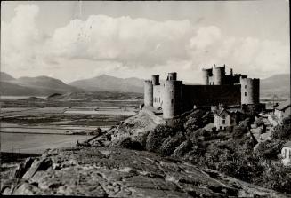 The frequent greyness of the skies over Britain is apparent in this panorama that shows Harlech castle and the outlines of the Welsh mountains etched (...)