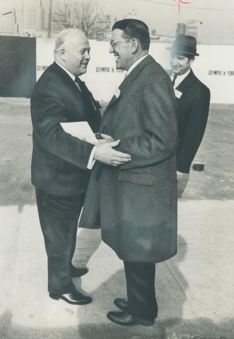 Allan Lamport, controller and former mayor, congratulates Beland H