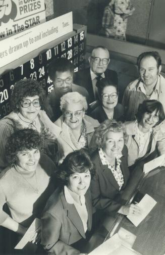 Lucky people: Ten of 18 winners in The Star's Super Bingo game collected their $420 winnings at The Star Yesterday
