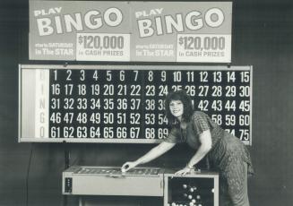 Big on Bingo: Jean Cahill, an executive secretary in a downtown insurance office, launched The Star's Super Bingo game in the lobby of the Star building by drawing the first numbers