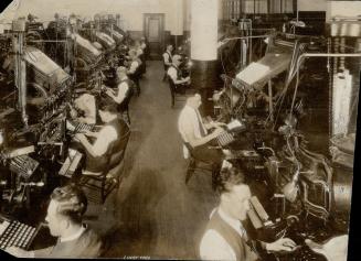 One section of the battery of 38 linotype machines which set in type the copy from the news room and advertising departments