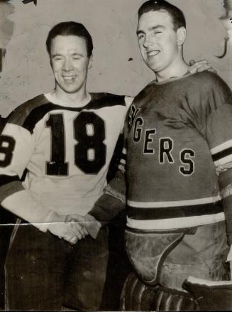 Mel Hill congratulated by Ranger's Goalkeeper, Gordie Drillon was the hero of the Leaf-Red Wing game here Saturday night and last evening in Boston Me(...)