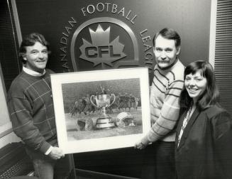 Winner of the Star's contest, James Coutoulakis has reason to smile after he won this Ken Danby print in the Star's Grey Cup contest