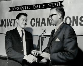 Tops in junior bowling, Champion of the 17-year-old boy's five-pin bowling competition, Gerry Coulthard (left) receives trophy from Gordon Kennedy, ma(...)