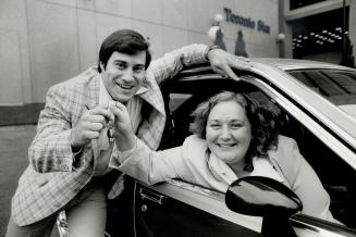 Starnumbers win, Sheila Windeler was all smiles yesterday when she picked up the keys for her 1980 Pontiac hatchback sedan form The Star's marketing director, Tom Murtha