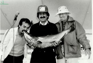Frank lafrate of Brampton holds his winning catch in the Toronto Star Great Salmon Hunt, a 36