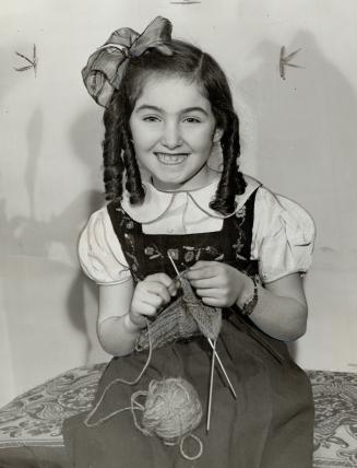 young lady is seven-year-old Alene Kamins of to, youngest competitor, who has been knitting for year and the mittens she entered do her credit. Alene (...)