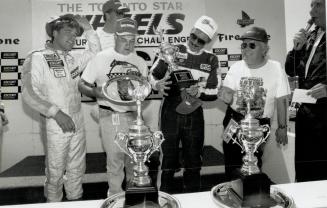Sweet moment: R. K. Smith (white hat) admires trophy his team reeived at 1991 Star 24 Horu World Challenge from Saturday Star editor Dennis Morgan