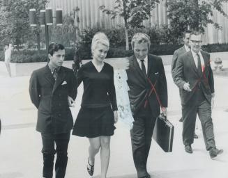 Arm in Arm with her husband, Peter Kappas, 21, Diane Baker Kappas, 20, leaves Metro Court House a free woman yesterday after her bail was reduced from(...)