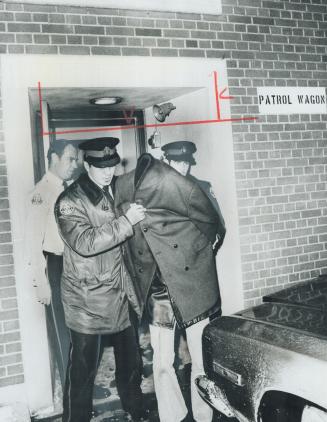Charged with murdering four people in Kitchener, 21-year-old Val Paul Palic of Mississauga is led from Metro police headquarters Saturday night after (...)