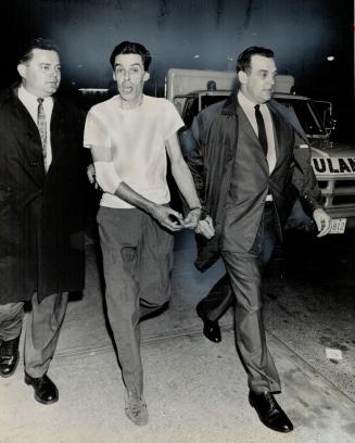 Fugitive Maurice Lemieux, Handcuffed to detective (right) he returns to jail