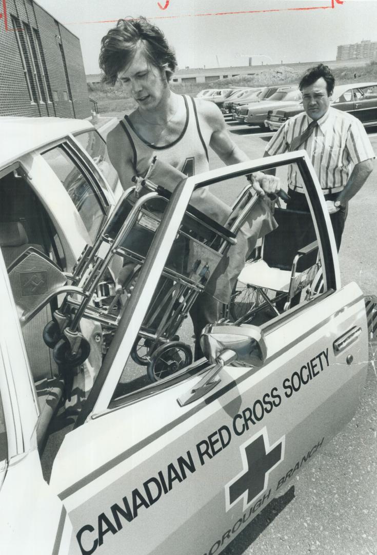 Serving his sentence, 17-year-old Mark Foley loads wheelchairs into a Red Cross vehicle to be delivered to disabled people in Scarborough. With him is(...)