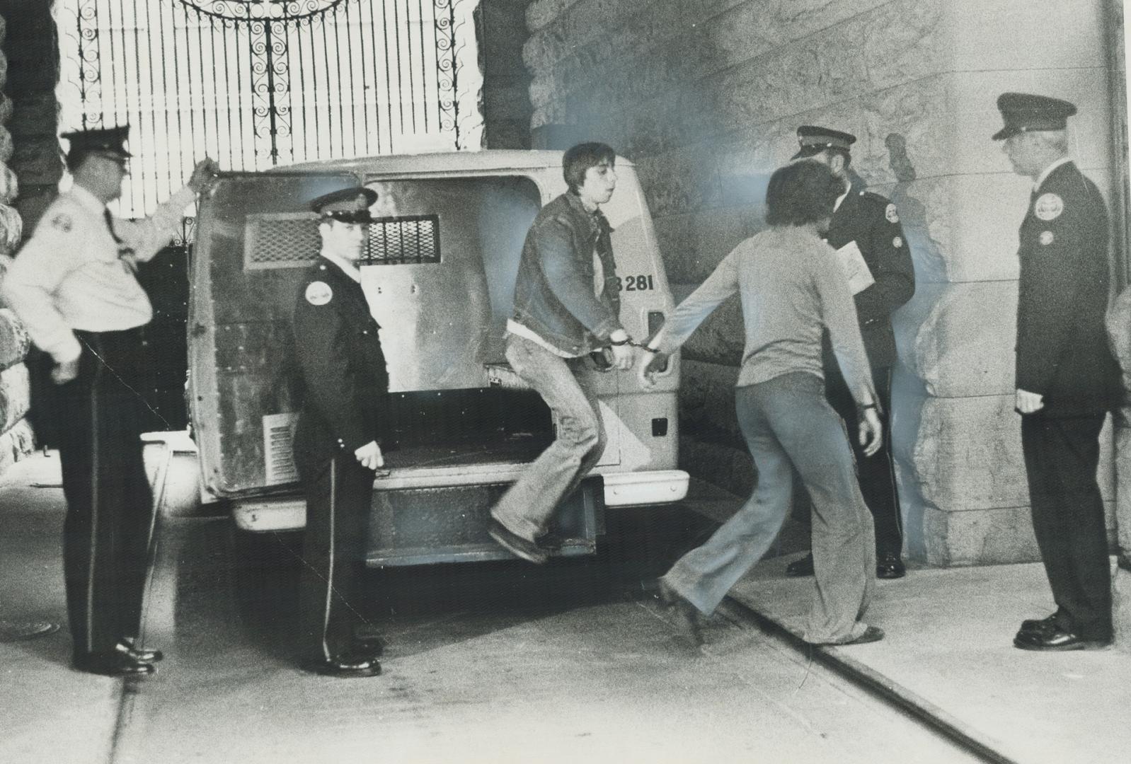 Police lead handcuffed suspected drug traffickers into station after a Metro-wide round-up of people believed involved in illegal narcotic trade early(...)