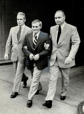 Acquitted on murder charge, handcuffed, Howard Dean, 39, acquitted of murder in the death of heroin addict Jack Richardson, is led out of the new cour(...)