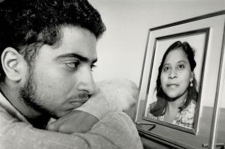 Sad anniversary, Susheel Gupta, 16, of Etobicoke looks at a picture of his mother, Ramwati Gupta, one of 329 passengers who were killed when an Air In(...)