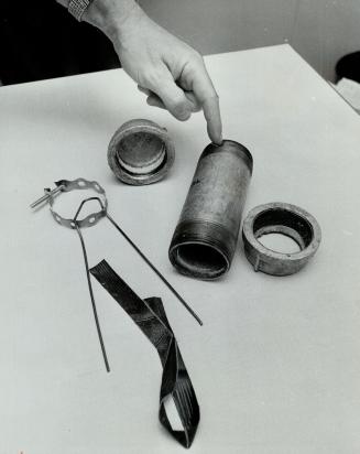 Components of the bombs are electrical conduit pipe, caps, pipe-hanger, electricians' tape, part of a coathanger, all easily obtainable and inexpensive items