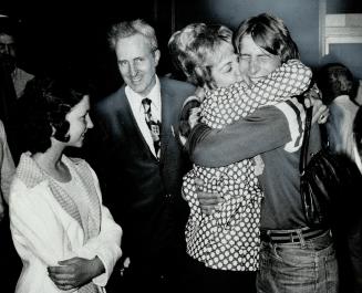 After 74 days in an Iranian jail on drug charges, 19-year-old Neil Cody of Hamilton greets his parents, Mr