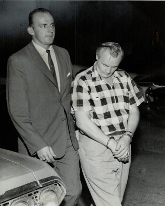 Suspect arrested in raids by RCMP who were cracking down on drug trafficking, Orville Charles Hardy (right) of Fulton Ave., Toronto, is taken into cus(...)