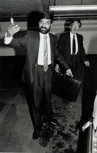 Under Fire: Dr. Chikmagalur Mohan, facing a disciplinary hearing, over sex assaults, gestures yesterday in the College of Physicians and Surgeons garage