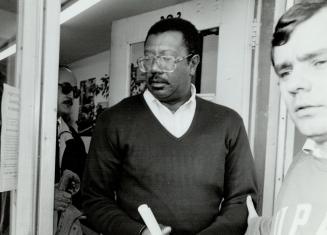 Under Arrest: Dudley Laws, left, of Metro and Larry Motley of Michigan are charged with smuggling illegal immigrants between Canada and the United States