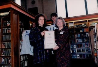 Receiving Tillium book award from Marilyn Mushinski