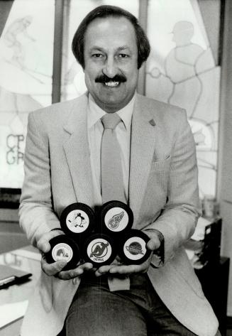 One of the top player agents in hockey, Gus Badali, who has the Great Gretzky on his side, holds pucks of teams that picked up his boys last week