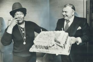 Dee-licious! Pearl Bailey samples the icing on her birthday cake