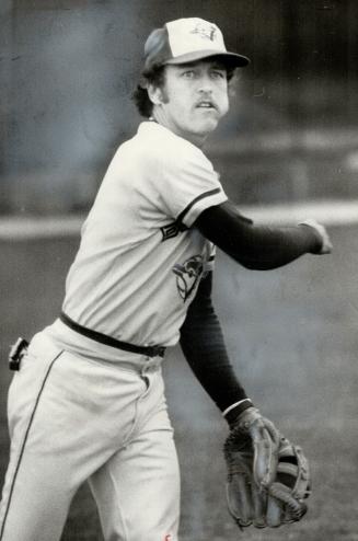 Don't Swallow, Bob! That bulge in Bob Bailor's left cheek is caused by a wad of chewing tobacco, a sub-sport favored by many baseball players, includi(...)