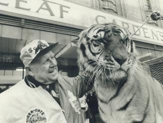 Leaf and Tiger-Cat owner Harold Ballard chats with Garden Brother circus star, Popeye the tiger