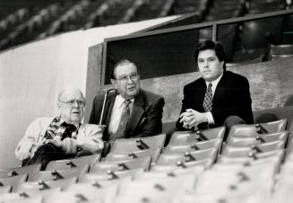 Watch It, Harold! Drawing a mock bead on the boss from ice level is harried Leafs coach John Brophy, but Harold Ballard doesn't look unduly concerned.(...)