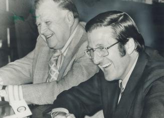 Ready to gamble at least $750,000 on Canadian television and radio rights to Canada-Russia hockey series are Harold Ballard (left) and Alan Eagleson. (...)
