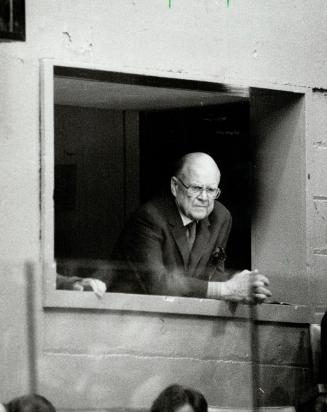 Looking grim: Leaf owner Harold Ballard looks down glumly from his private box during last night's losing effort, a far different Ballard than was seen after the past two games, which Leafs won