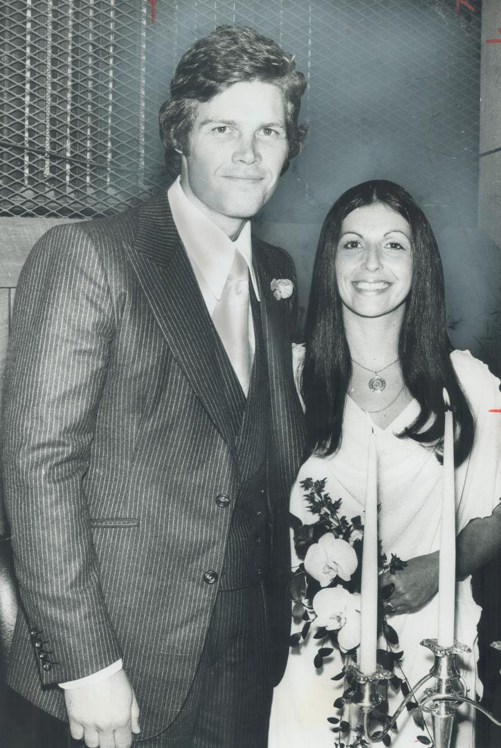 Gardens reception. Harold Ballard Jr., son of the president of Maple Leaf Gardens, is pictured with his bride Nelja Botrie, as they arrived at their r(...)