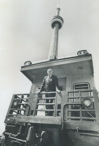 CN President Robert Bandeen stands on the back of his railway car at the foot of the CN tower